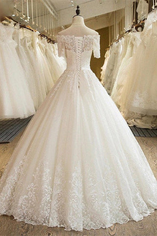 Robe de mariée en tulle et dentelle à épaules dénudées et manches 3/4