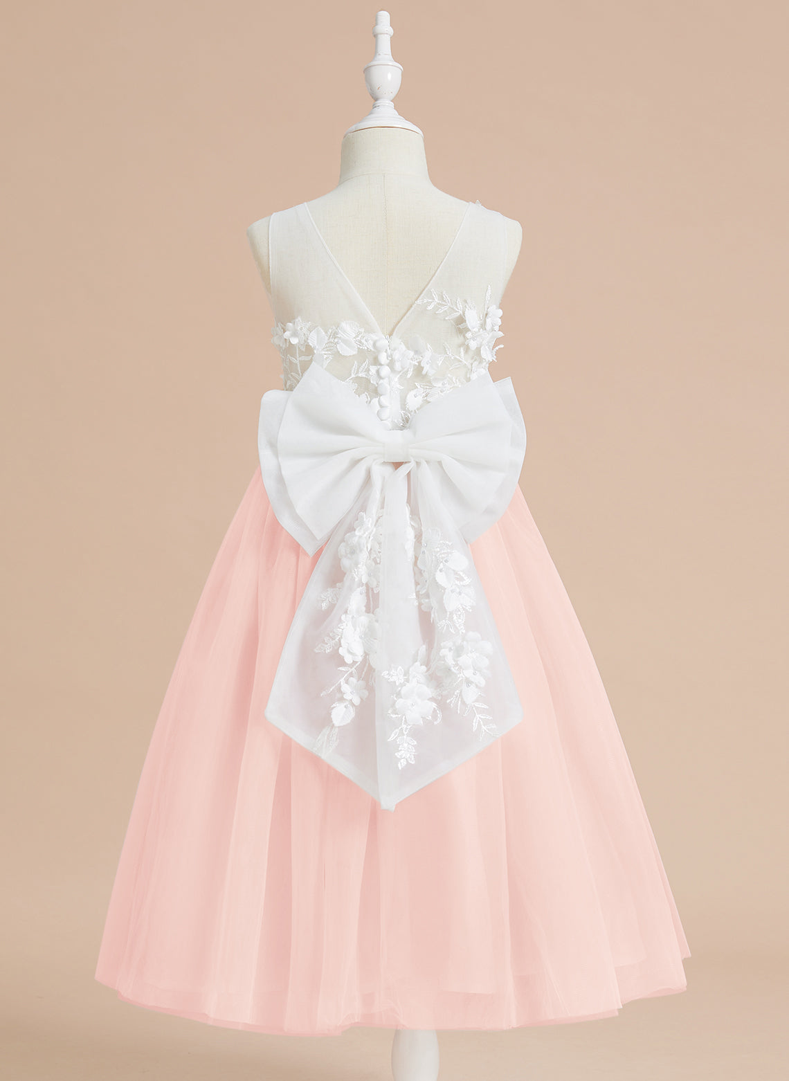 Vestido midi de encaje floral y lazo grande 
