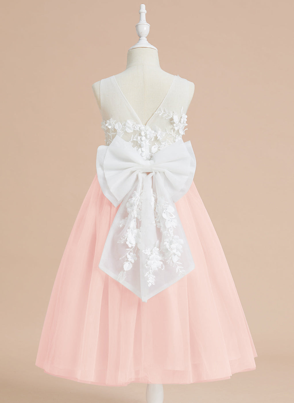 Vestido midi de encaje floral y lazo grande 