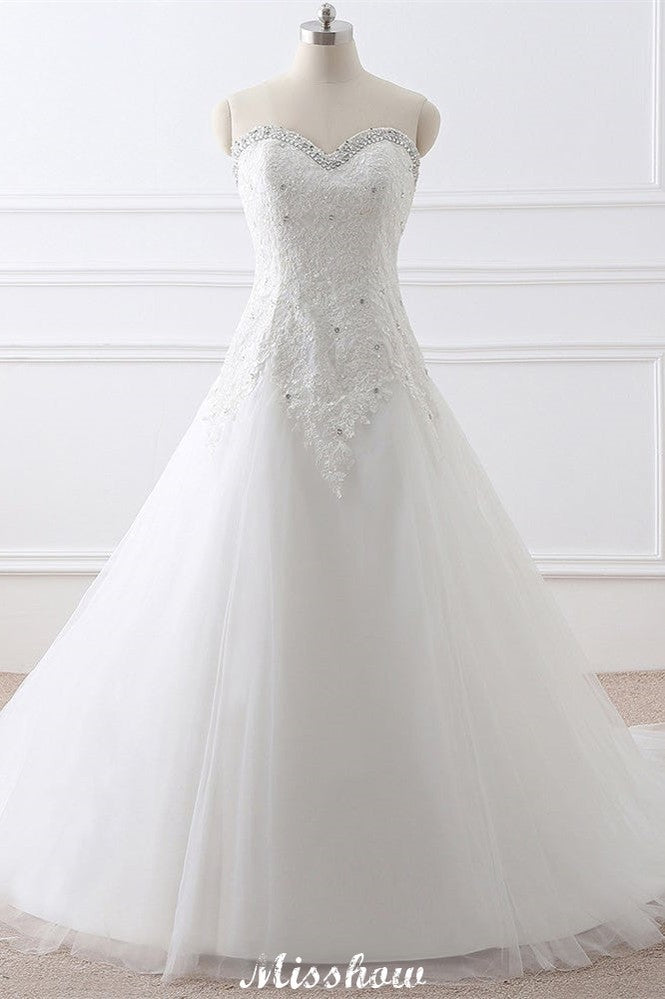 Robe de mariée princesse en tulle à décolleté cœur et dentelle