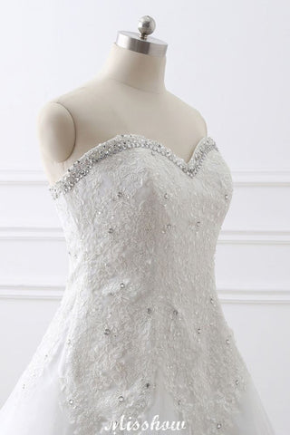 Vestido de novia de tul estilo princesa con escote corazón y encaje