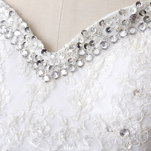 Vestido de novia de tul estilo princesa con escote corazón y encaje