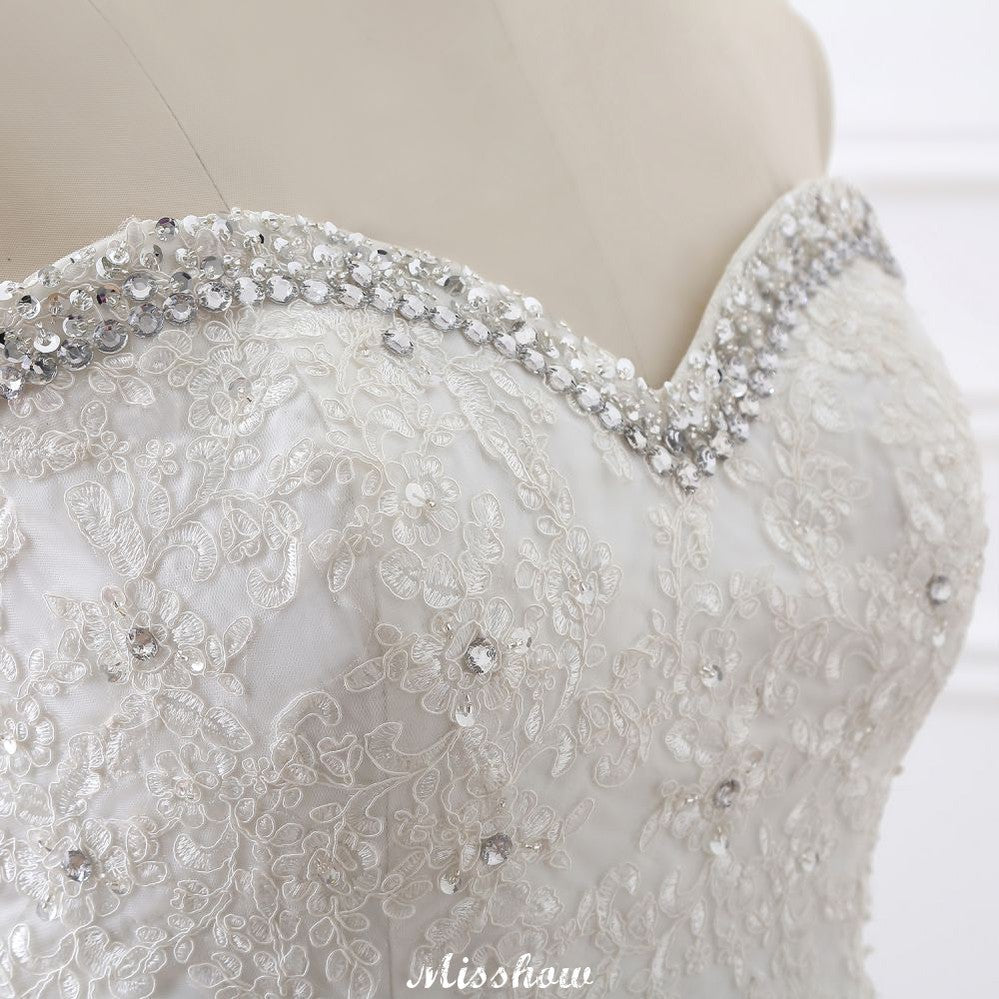Robe de mariée princesse en tulle à décolleté cœur et dentelle