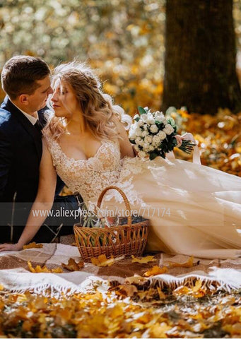 Vestido de novia largo y elegante de corte A con escote en V, apliques de encaje, mangas casquillo y detalles de perlas con cordones, estilo Baoleely.