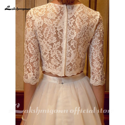 Vestidos de novia de dos piezas Baoleely con cuello joya, cola de corte, tul sobre encaje, encaje con cordón, manga corta ilusión con fajines/cintas.