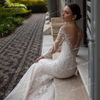 Baoleely Gorgeous Lace A-Line Wedding Dresses Illusion Boat Neck Long Sleeve Sweep/Brush Train Tulle Bride Gowns Pleats Appliques Beading