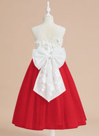 Vestido midi de encaje floral y lazo grande 