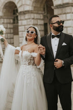 Vestido de novia romántico de tul con hombros descubiertos, mangas cortas y corte en A