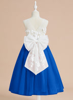 Vestido midi de encaje floral y lazo grande 