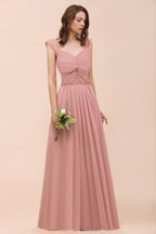 Vestido largo de dama de honor rosa empolvado con tirantes y volantes para niñas