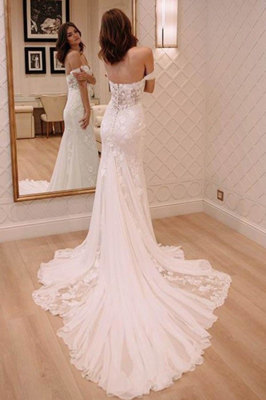 Robe de mariée élégante ivoire, sexy, épaules dénudées, ornée d'appliqués et traîne courte, idéale pour la plage.