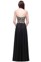 Vestidos largos de fiesta negros sin mangas, con escote redondo y apliques hasta el suelo.