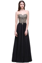 Vestidos largos de fiesta negros sin mangas, con escote redondo y apliques hasta el suelo.