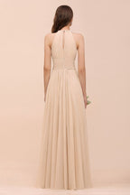 Robe de demoiselle d'honneur longue et cintrée couleur champagne, simple et dos nu