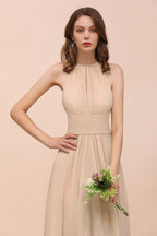 Robe de demoiselle d'honneur longue et cintrée couleur champagne, simple et dos nu