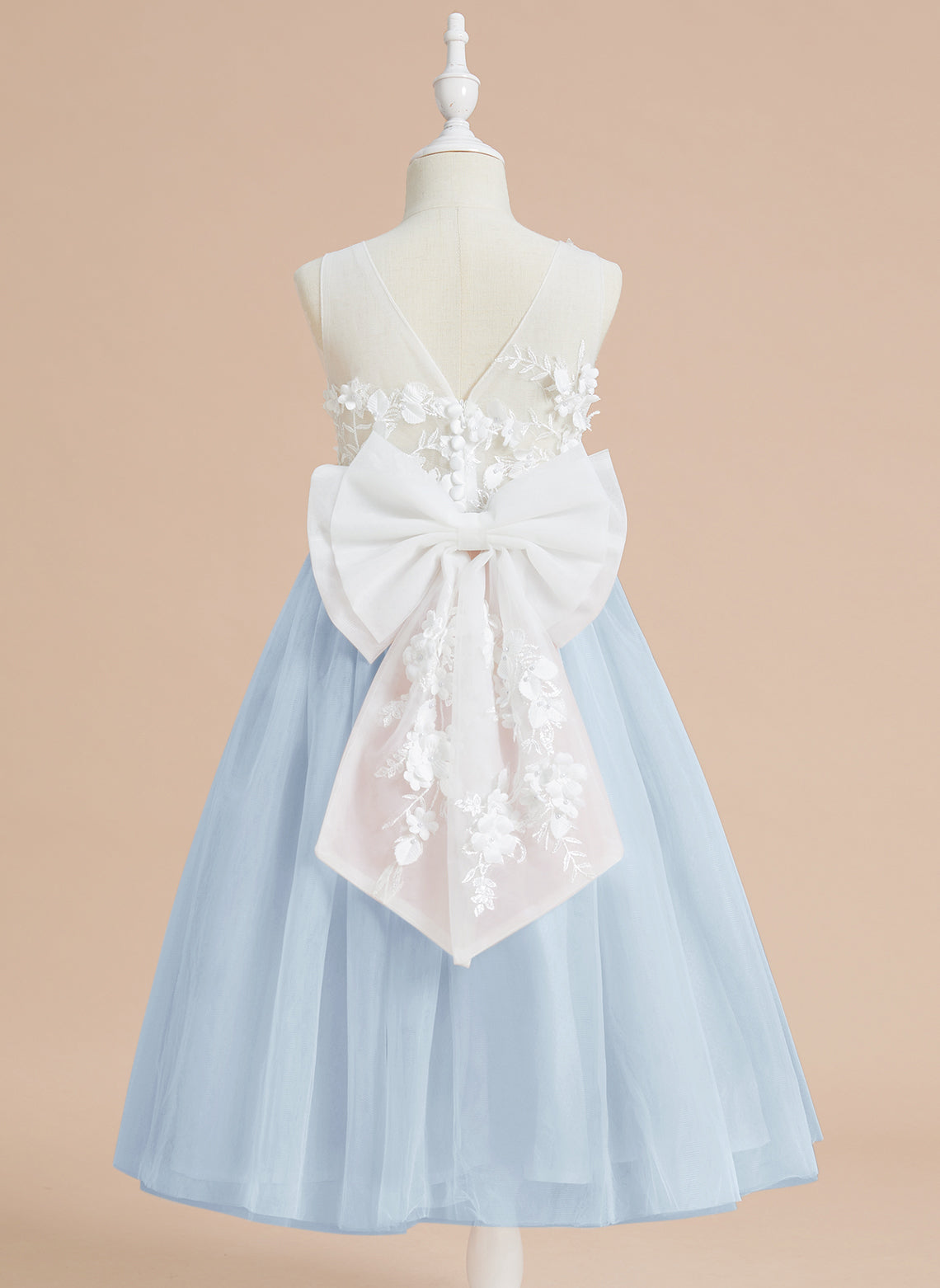 Vestido midi de encaje floral y lazo grande 