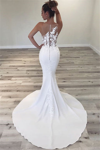 Vestido de novia de tul transparente sin mangas, corte sirena. Hermosos vestidos para bodas.
