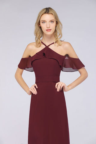 Vestido de dama de honor largo hasta el suelo, sin mangas, con tirantes finos, volantes y fajín con lazo.