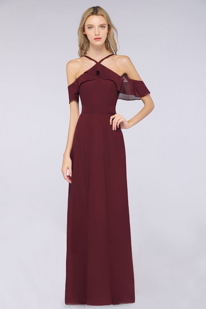 Vestido de dama de honor largo hasta el suelo, sin mangas, con tirantes finos, volantes y fajín con lazo.
