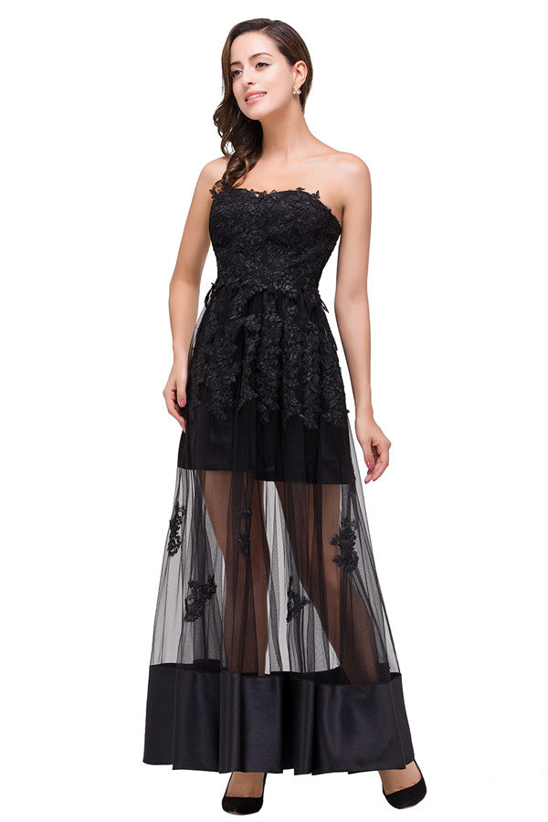 Robe de bal noire bustier, longueur genou, coupe trapèze, lacée et ornée d'appliques