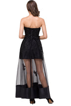 Robe de bal noire bustier, longueur genou, coupe trapèze, lacée et ornée d'appliques