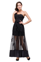 Robe de bal noire bustier, longueur genou, coupe trapèze, lacée et ornée d'appliques