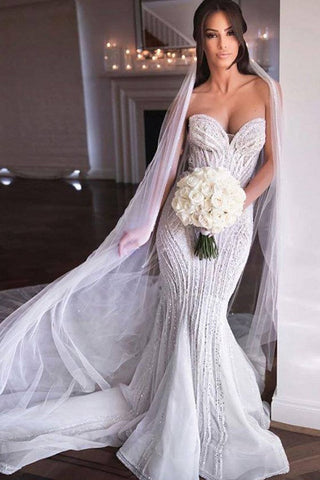 Vestido de novia de sirena sin tirantes con escote corazón, cuentas, apliques de tul y falda nupcial