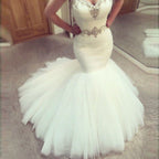 Vestido de novia sirena con volantes y escote corazón