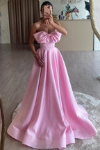 Tomie | Vestido largo de fiesta formal rosa, corte A, sin tirantes, con lazo y plisado de satén