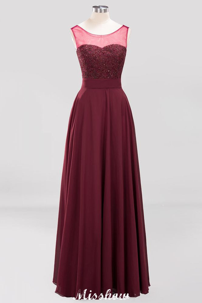 Robe de demoiselle d'honneur longue sans manches en tulle et dentelle ornée de perles et de bijoux, coupe trapèze, en mousseline et tulle.