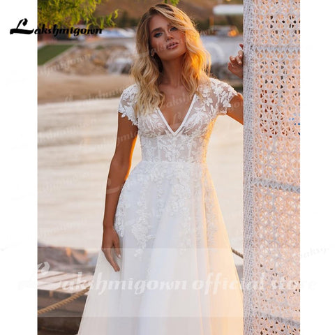Baoleely V Neck Short Sleeve Lace Appliques Open Back Wedding Dresses