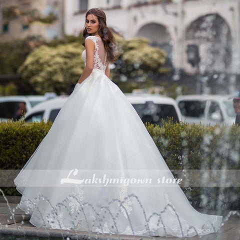 Baoleely White Wedding Dresses Appliques Sequined Cap Sleeve