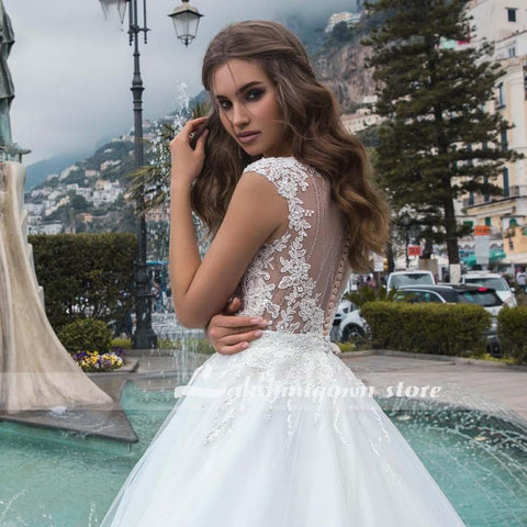 Baoleely White Wedding Dresses Appliques Sequined Cap Sleeve