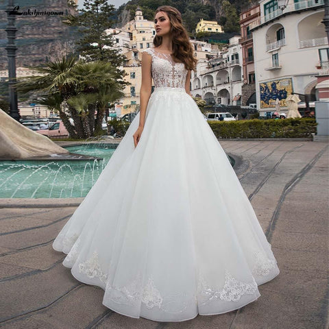 Baoleely White Wedding Dresses Appliques Sequined Cap Sleeve